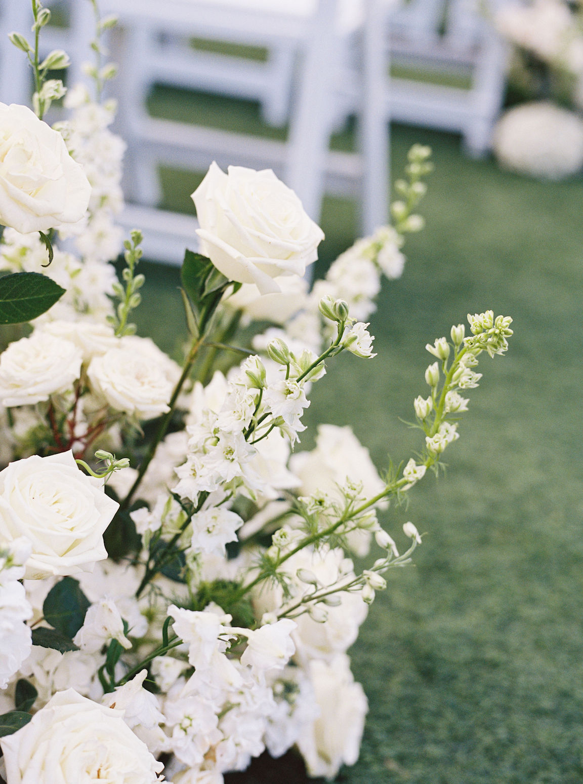 Omni Barton Creek Wedding ceremony on yard with lush white florals