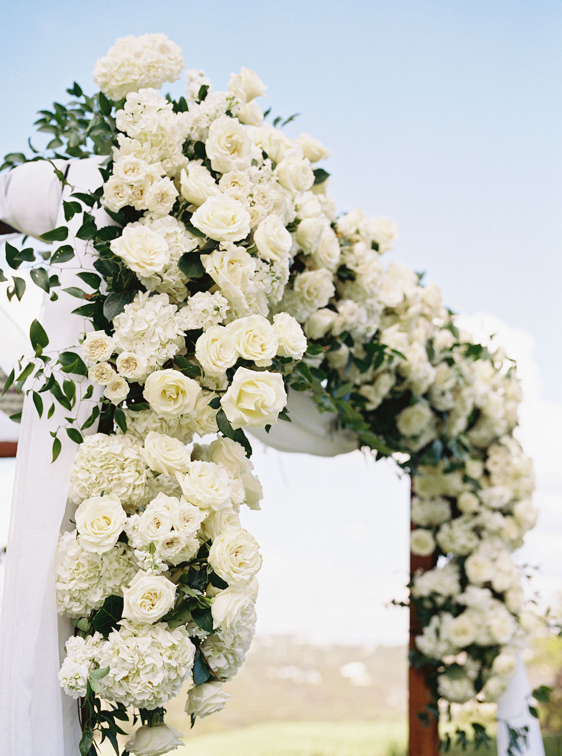 Omni Barton Creek Wedding ceremony on yard with lush white florals