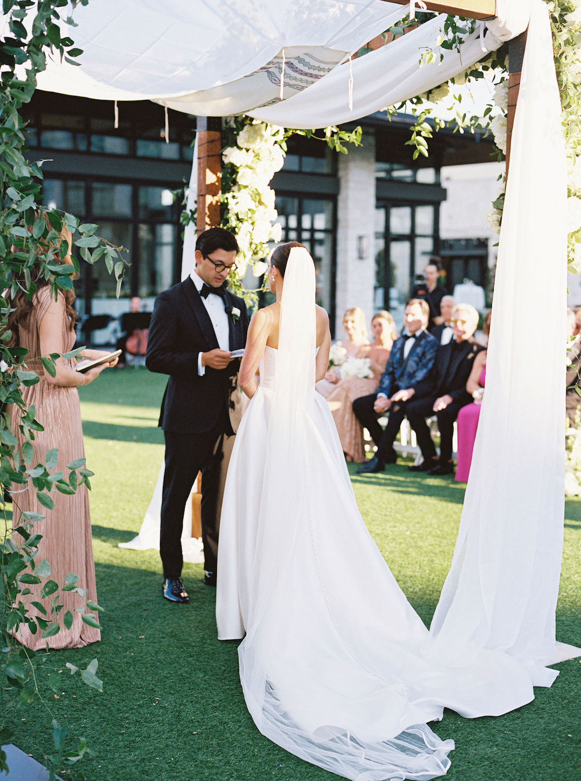 Omni Barton Creek Wedding ceremony on yard with lush white florals