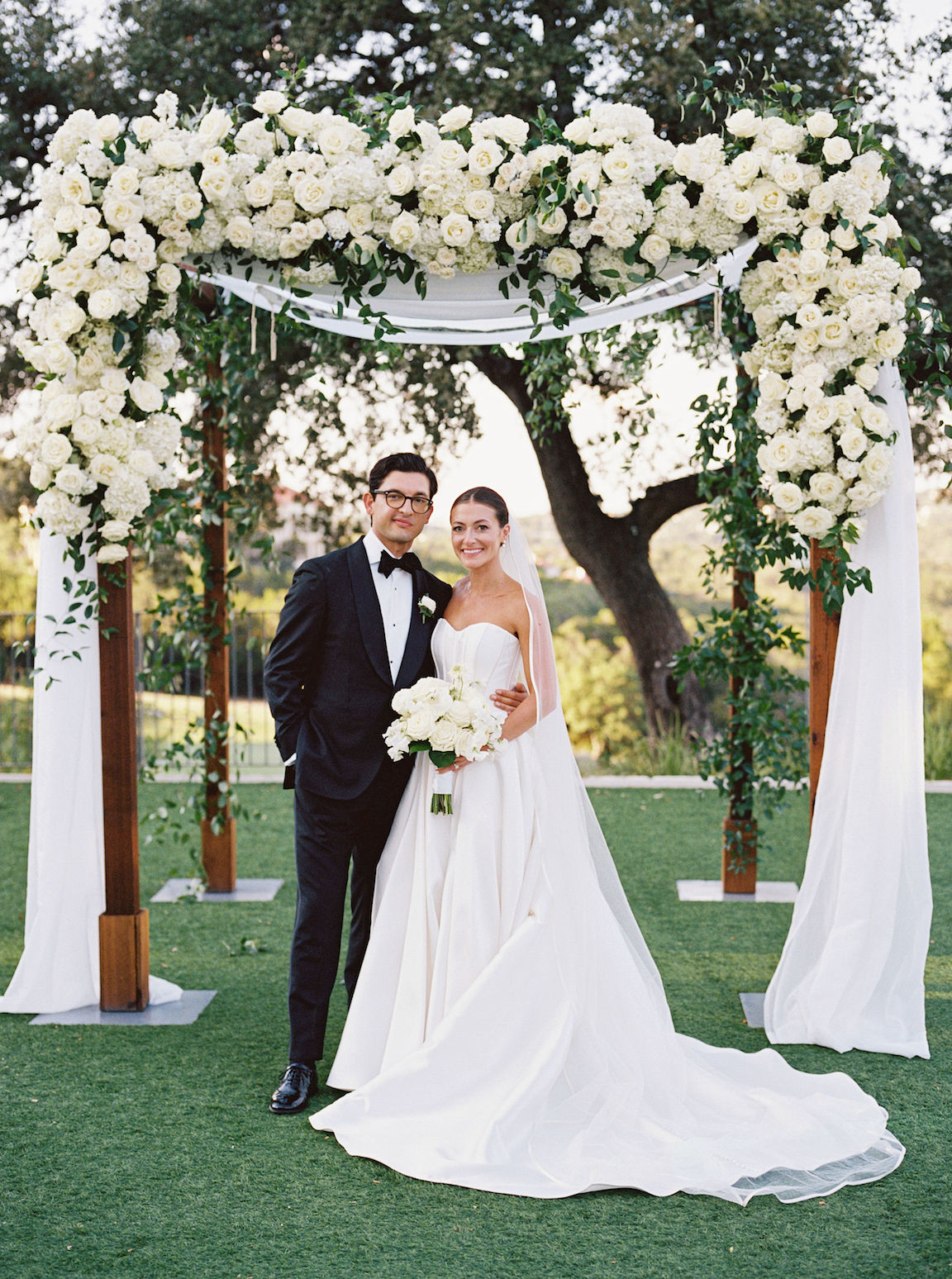 Omni Barton Creek Wedding ceremony on yard with lush white florals