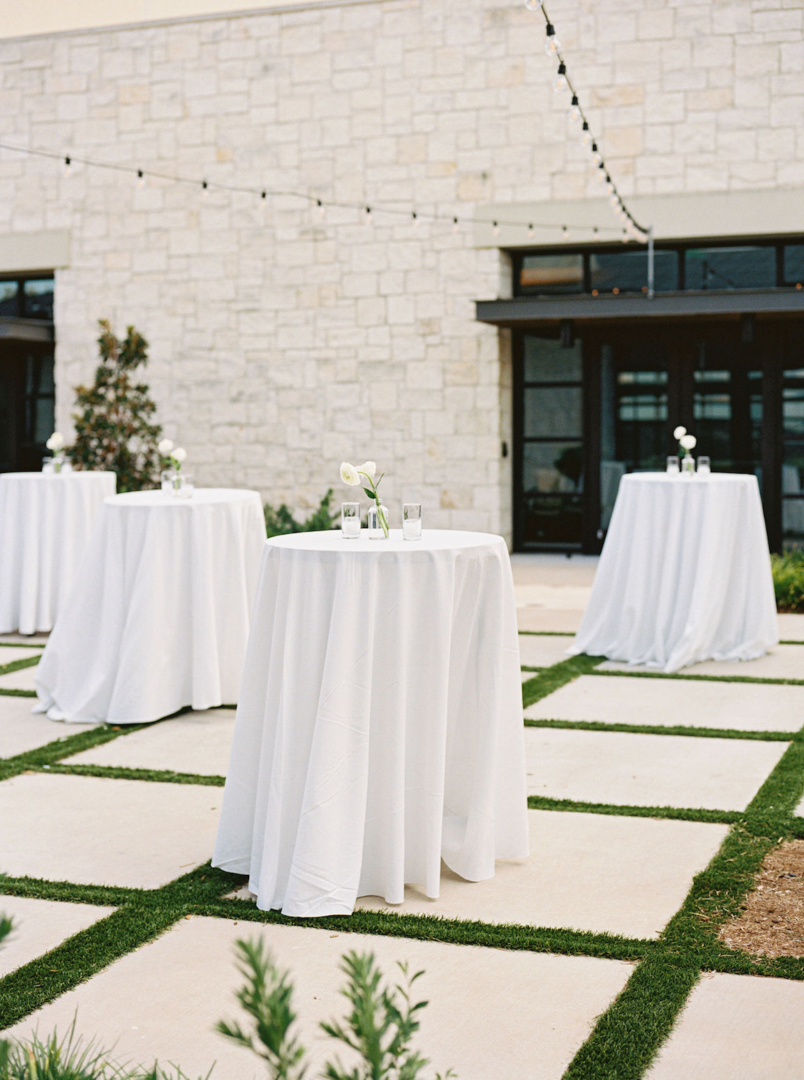 Omni Barton Creek Wedding cocktail hour on yard with lush white florals