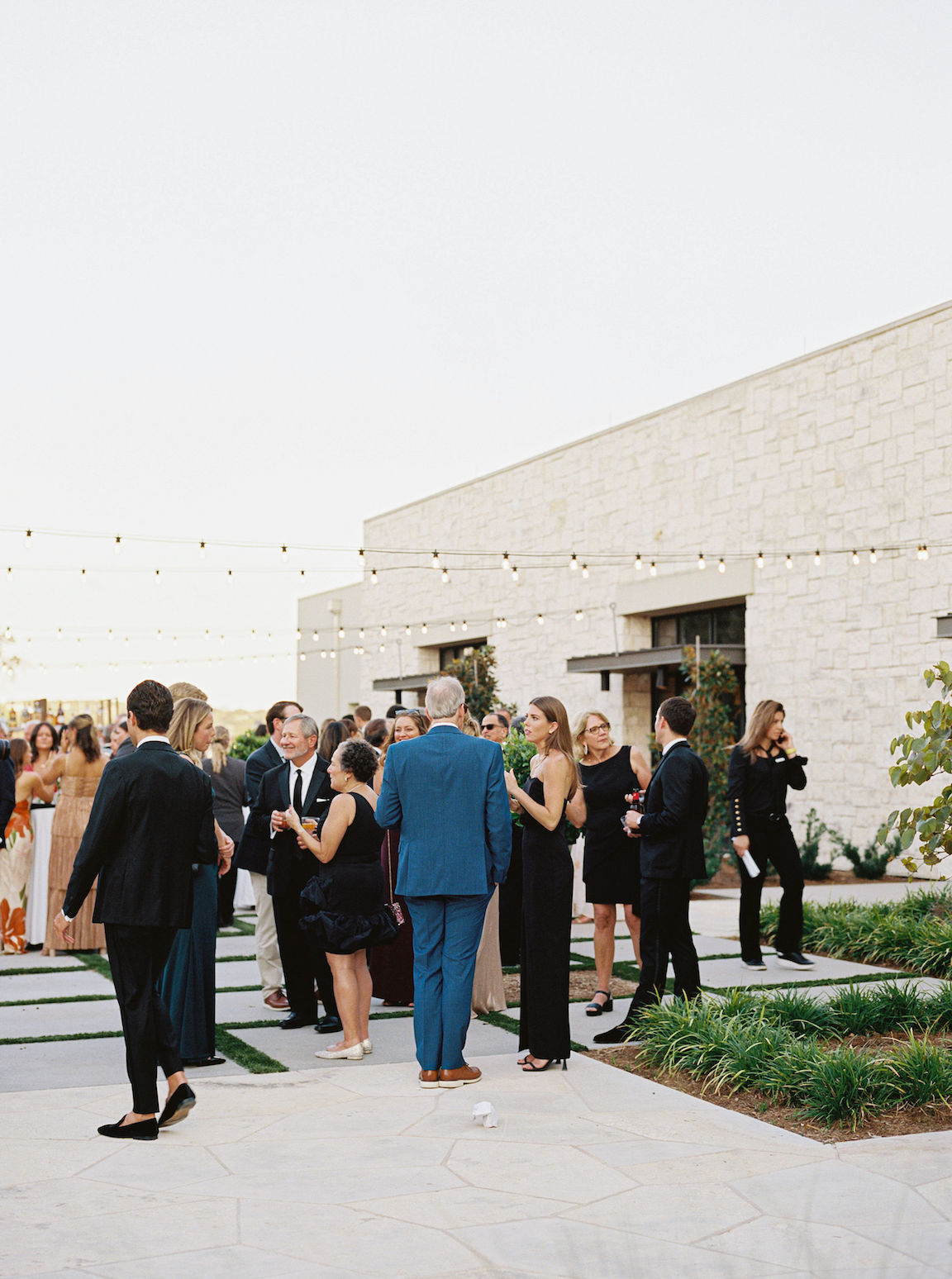 Omni Barton Creek Wedding cocktail hour on yard with lush white florals