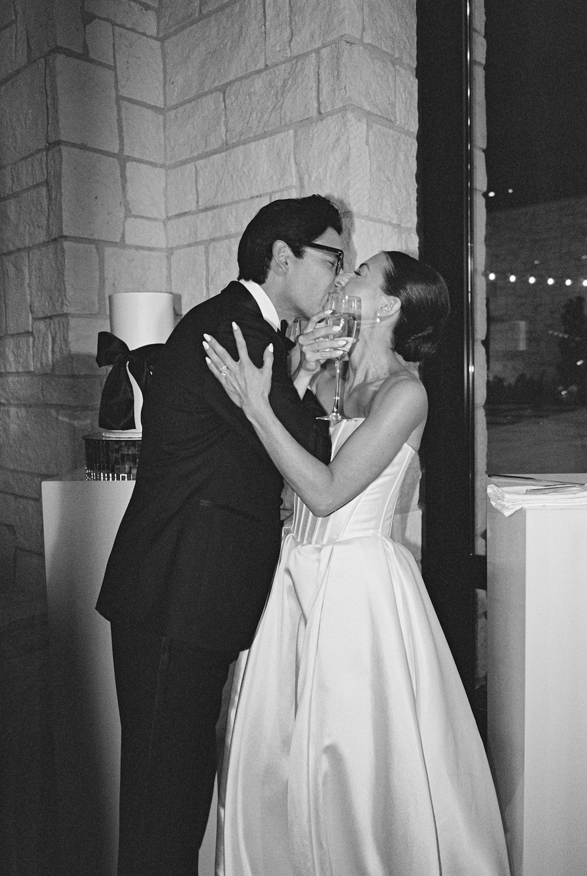 elegant Omni Barton Creek Wedding reception bride and groom cake cutting