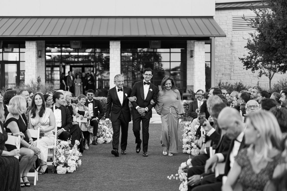 Omni Barton Creek Wedding ceremony on yard with lush white florals