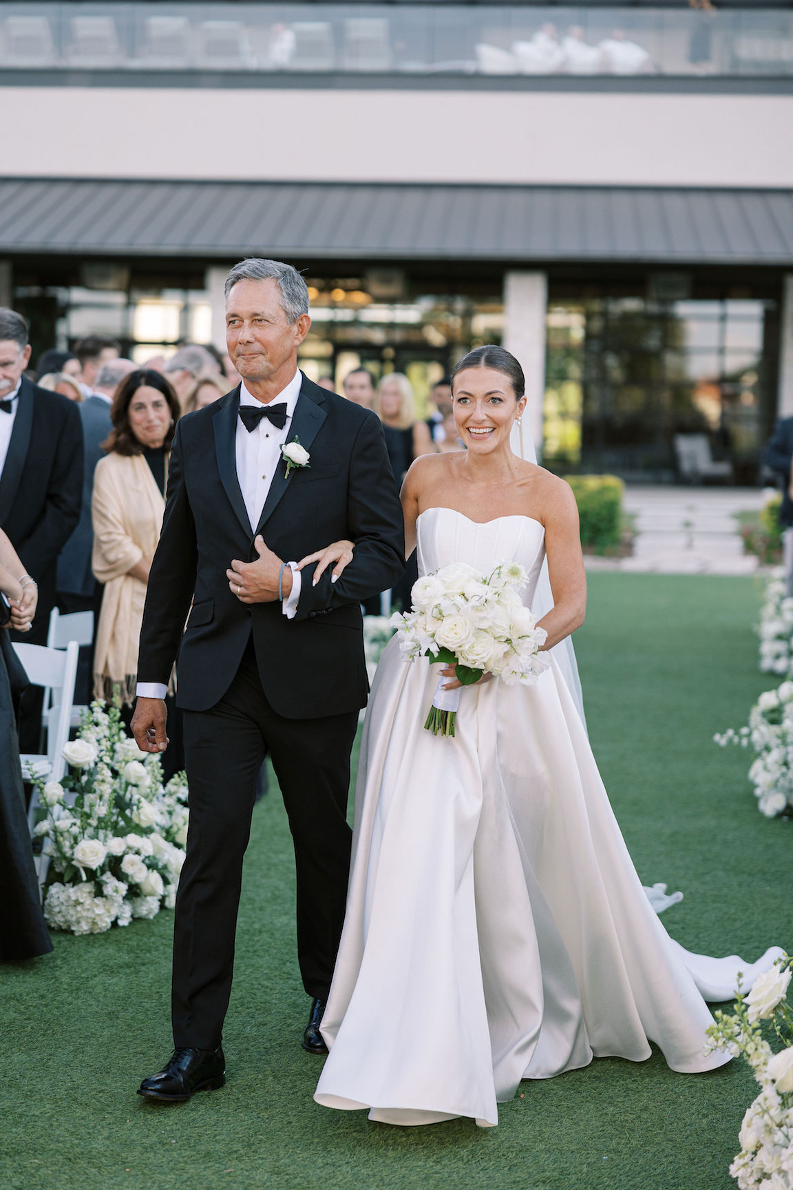 Omni Barton Creek Wedding ceremony on yard with lush white florals