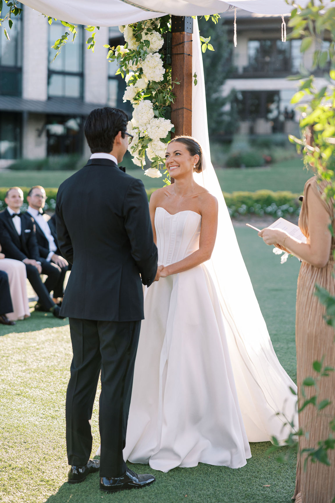 Omni Barton Creek Wedding ceremony on yard with lush white florals