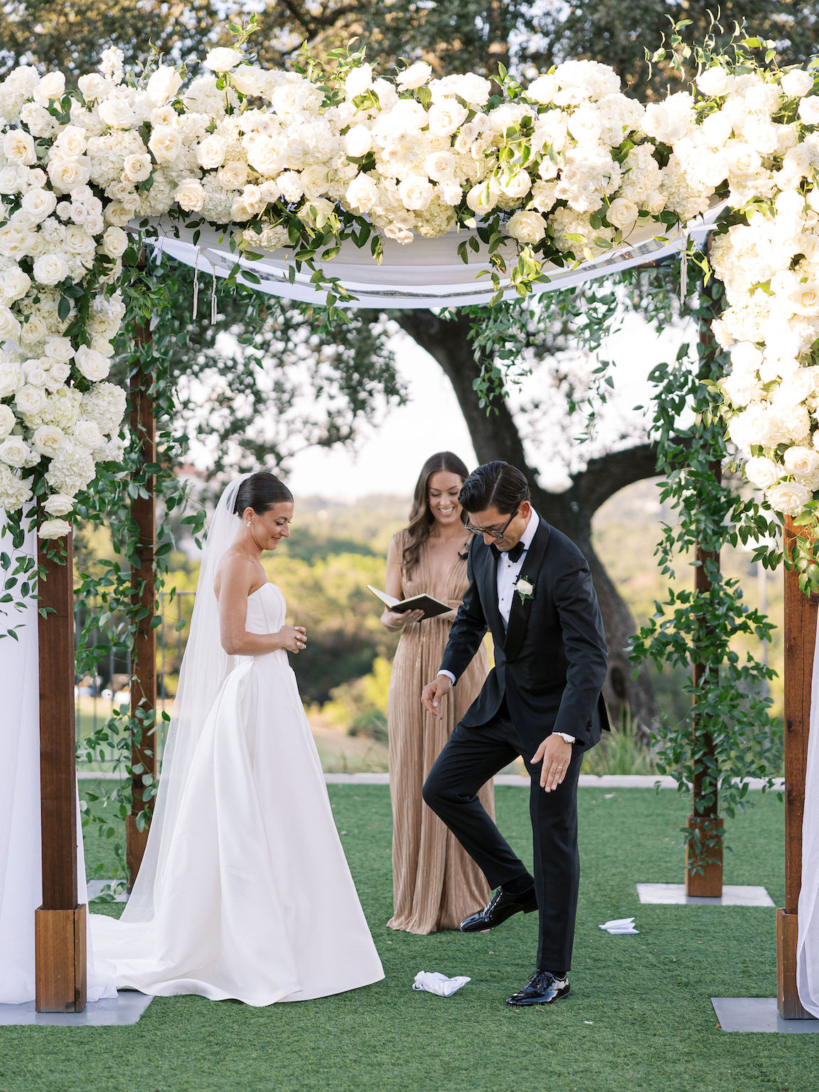 Omni Barton Creek Wedding ceremony on yard with lush white florals