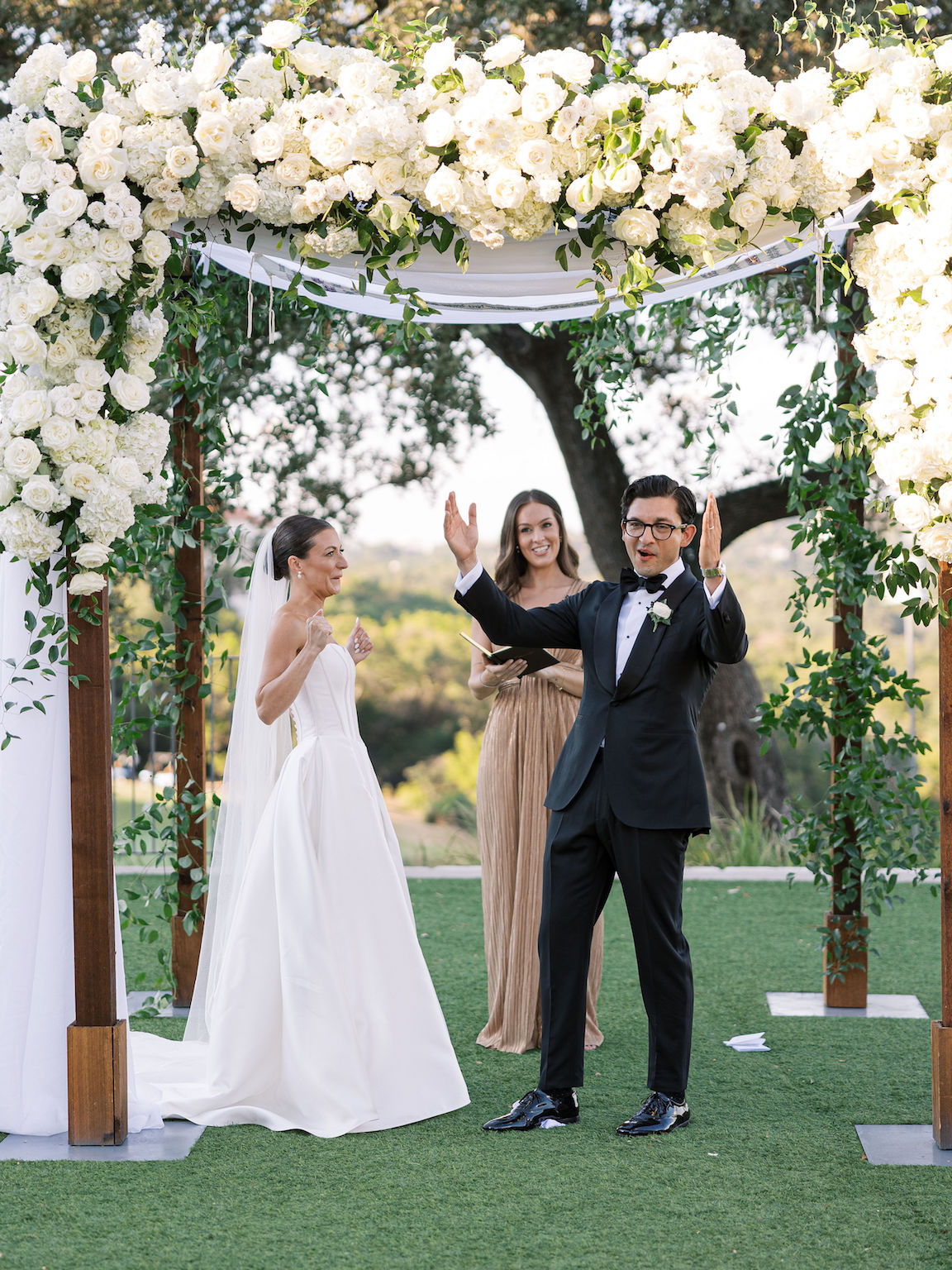 Omni Barton Creek Wedding ceremony on yard with lush white florals