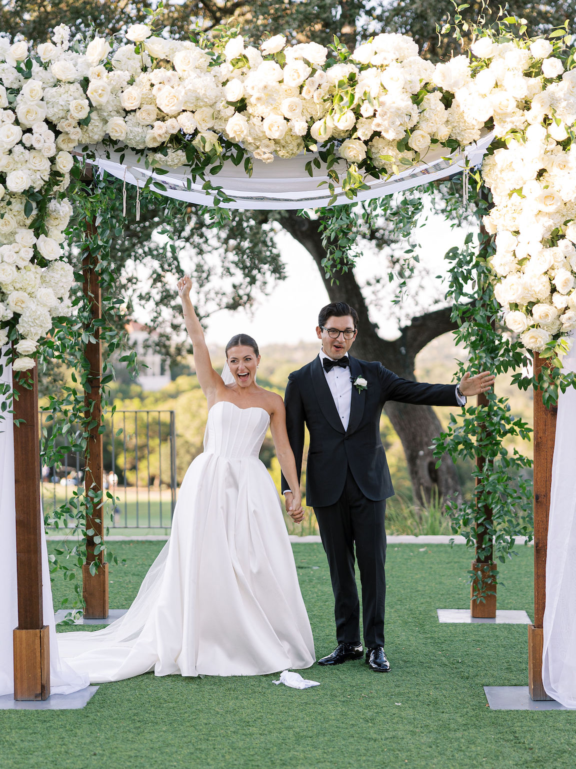 Omni Barton Creek Wedding ceremony on yard with lush white florals