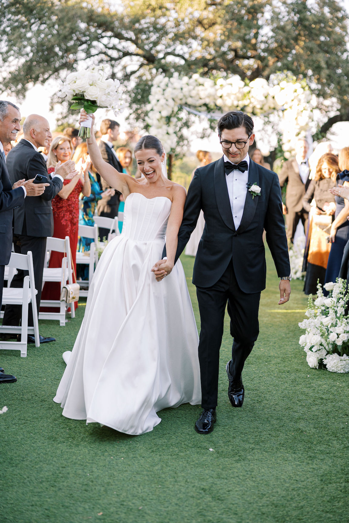 Omni Barton Creek Wedding ceremony on yard with lush white florals