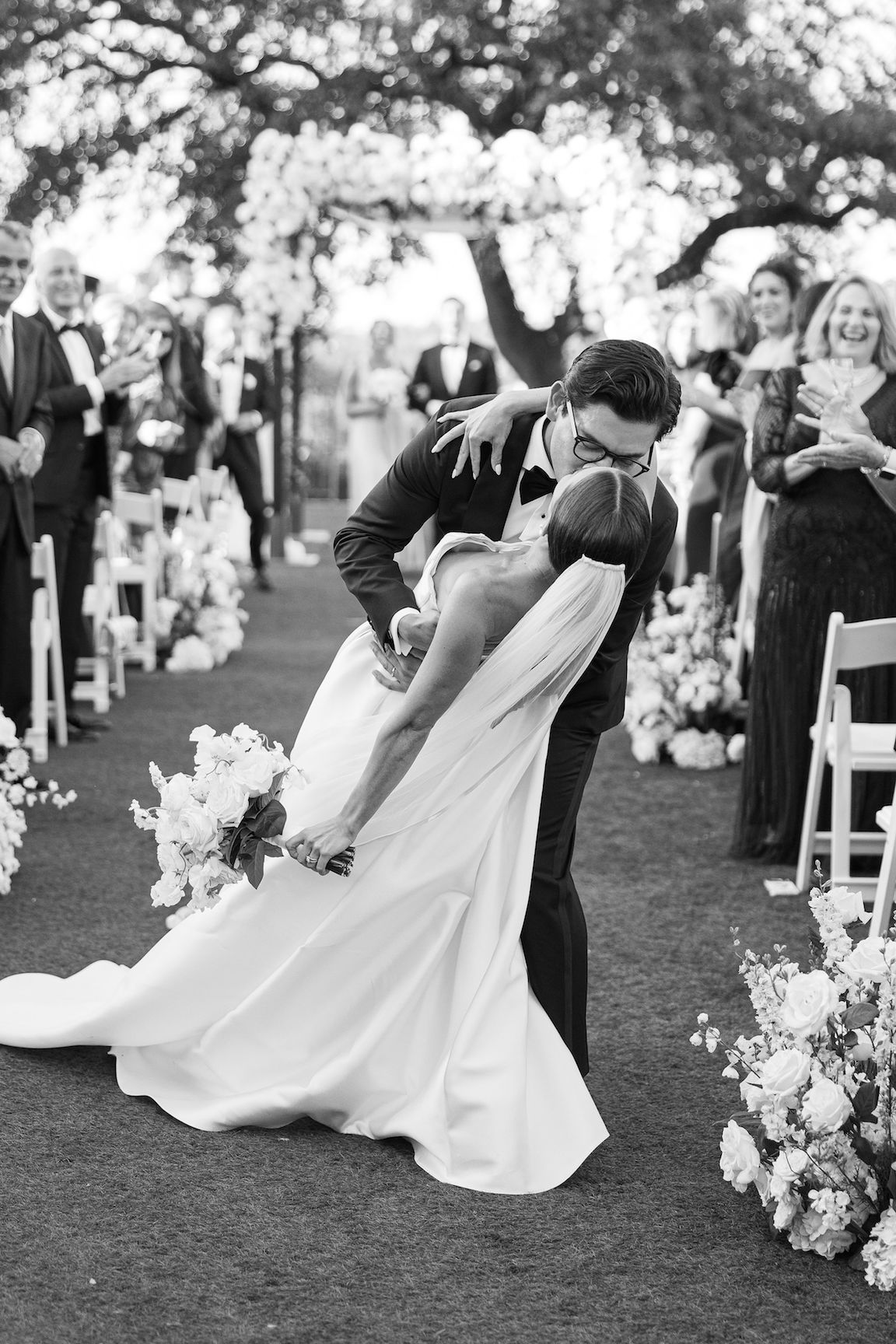 Omni Barton Creek Wedding ceremony on yard with lush white florals