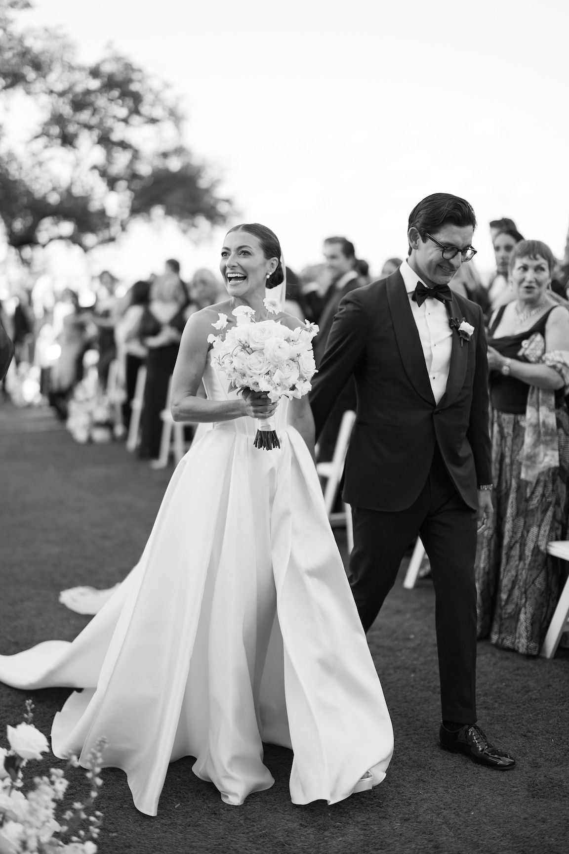 Omni Barton Creek Wedding ceremony on yard with lush white florals