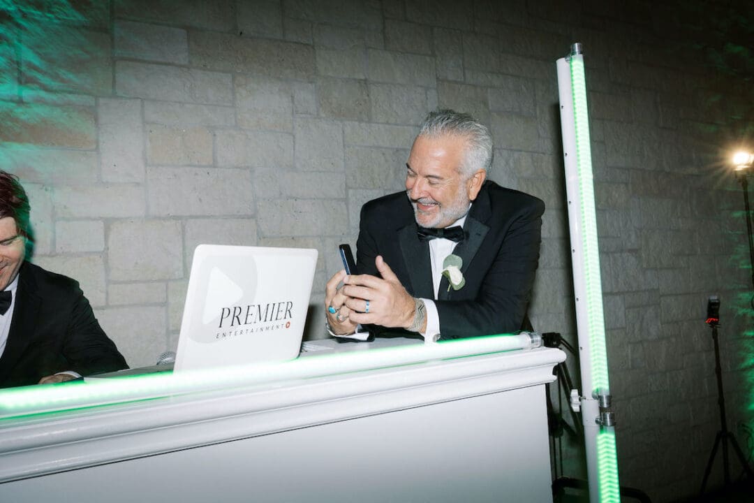 Packed dancefloor at Omni Barton Creek wedding with live band and joyful guests celebrating