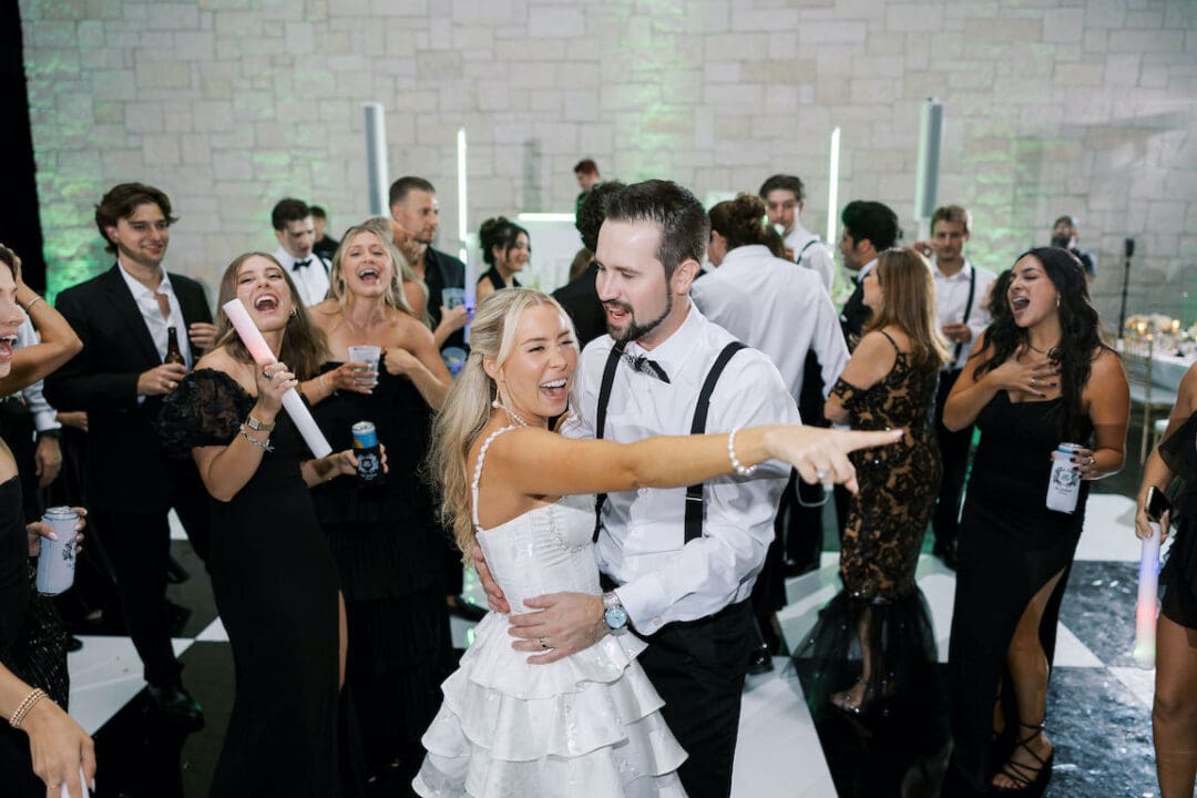 Packed dancefloor at Omni Barton Creek wedding with live band and joyful guests celebrating