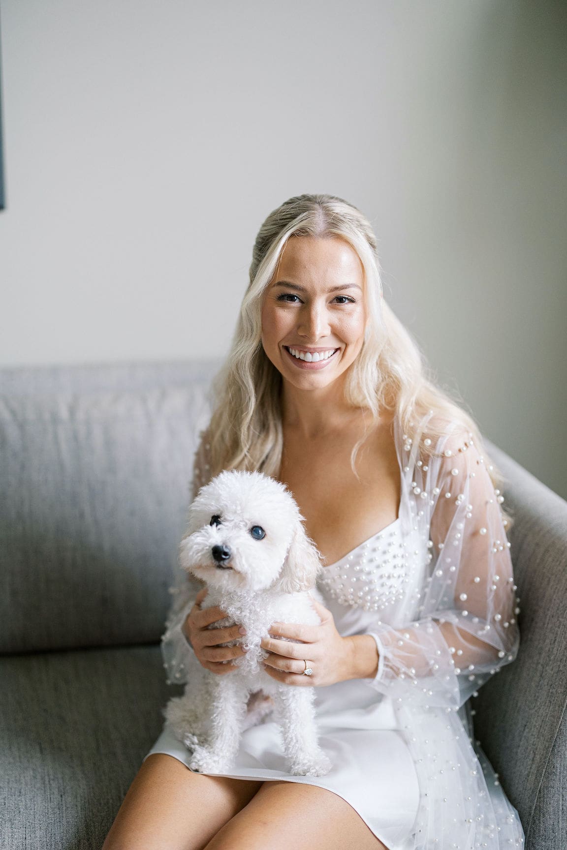 Bride getting ready in elegant suite at Omni Barton Creek, captured in timeless film wedding photography