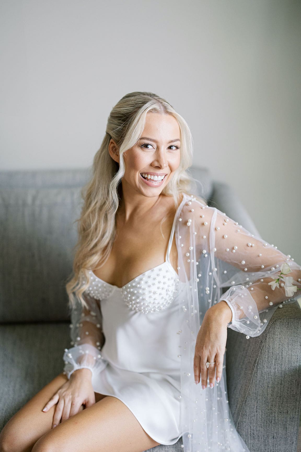 Bride getting ready in elegant suite at Omni Barton Creek, captured in timeless film wedding photography