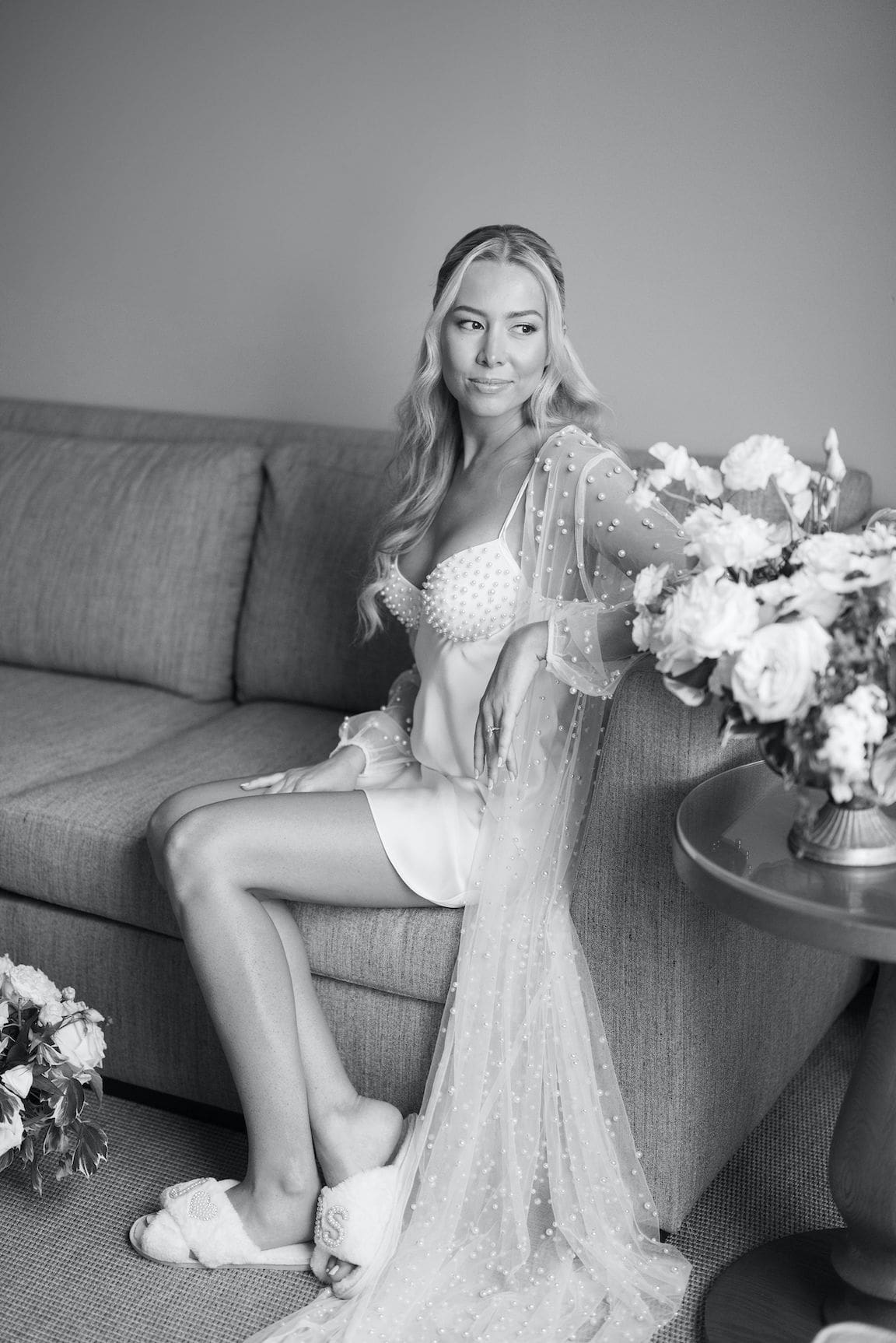 Bride getting ready in elegant suite at Omni Barton Creek, captured in timeless film wedding photography
