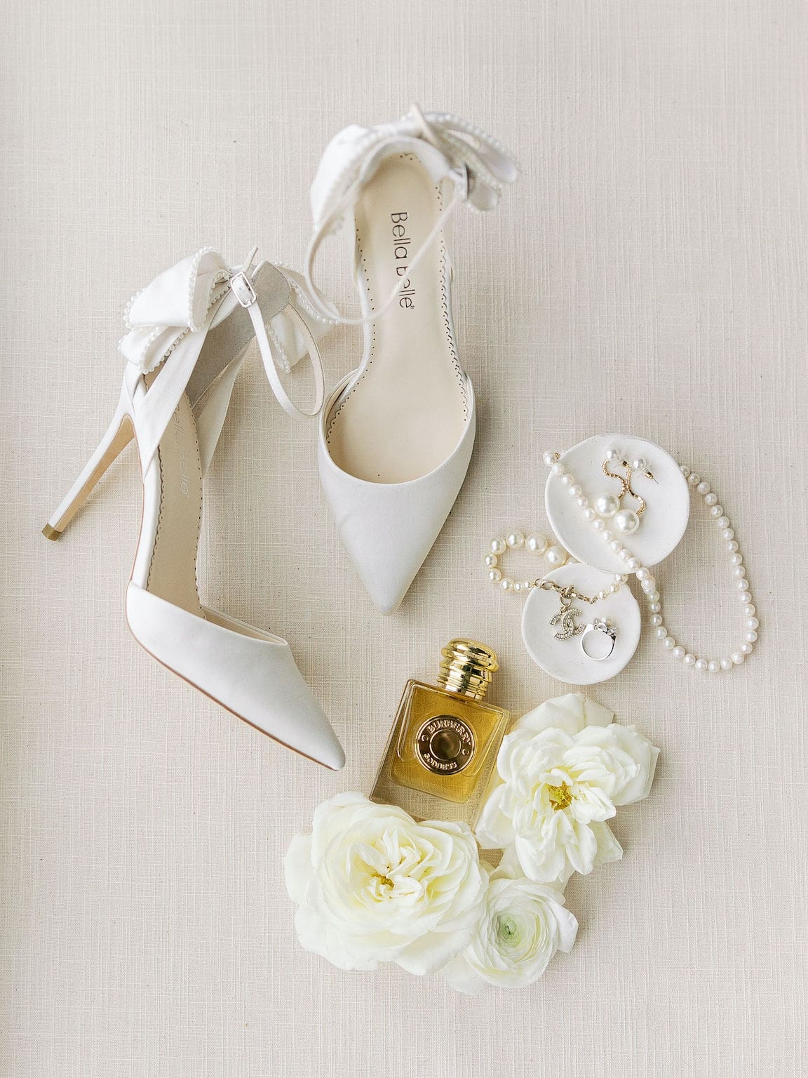 Bride getting ready in elegant suite at Omni Barton Creek, captured in timeless film wedding photography