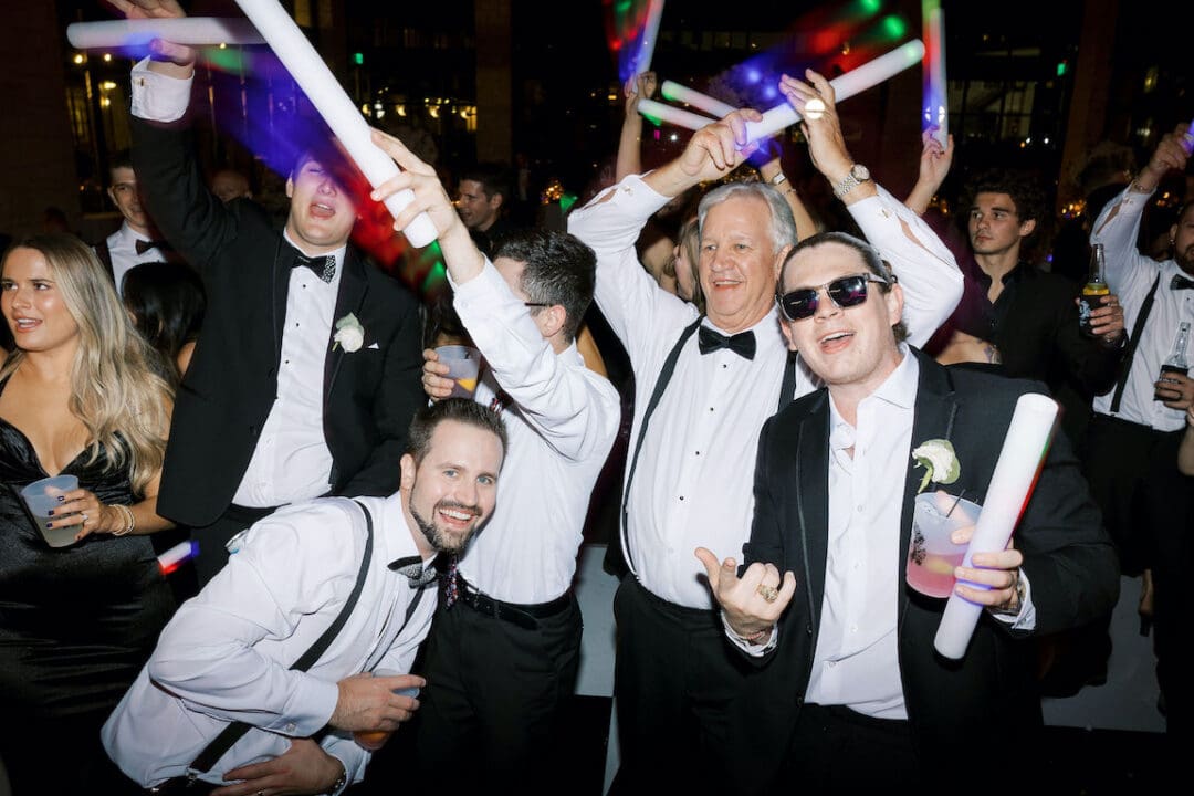 Packed dancefloor at Omni Barton Creek wedding with live band and joyful guests celebrating