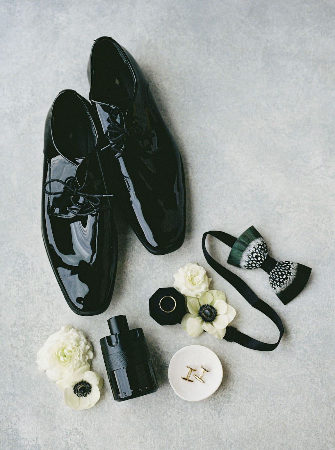 Bride getting ready in elegant suite at Omni Barton Creek, captured in timeless film wedding photography