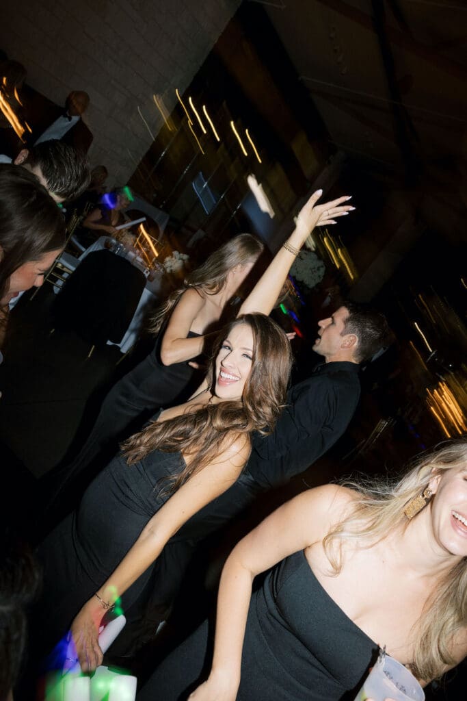 Packed dancefloor at Omni Barton Creek wedding with live band and joyful guests celebrating