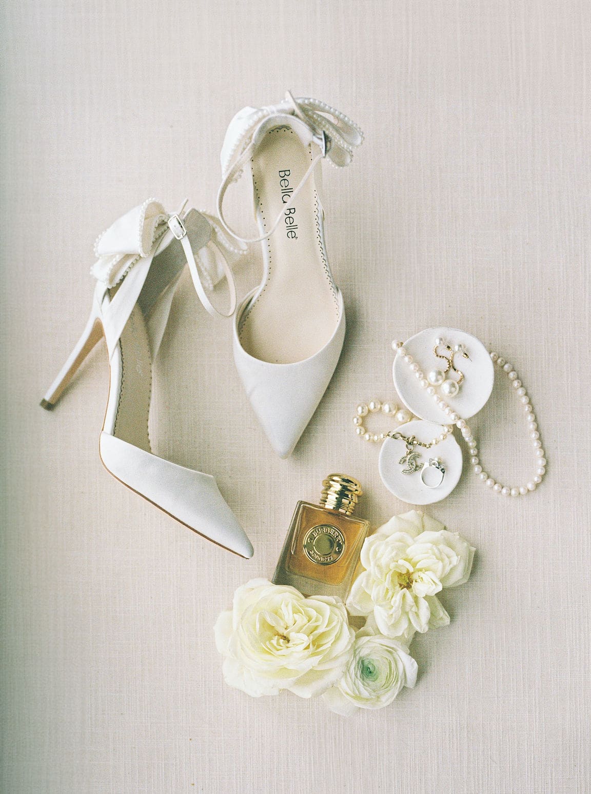 Bride getting ready in elegant suite at Omni Barton Creek, captured in timeless film wedding photography