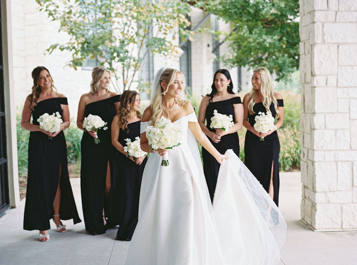 Bride getting ready in elegant suite at Omni Barton Creek, captured in timeless film wedding photography
