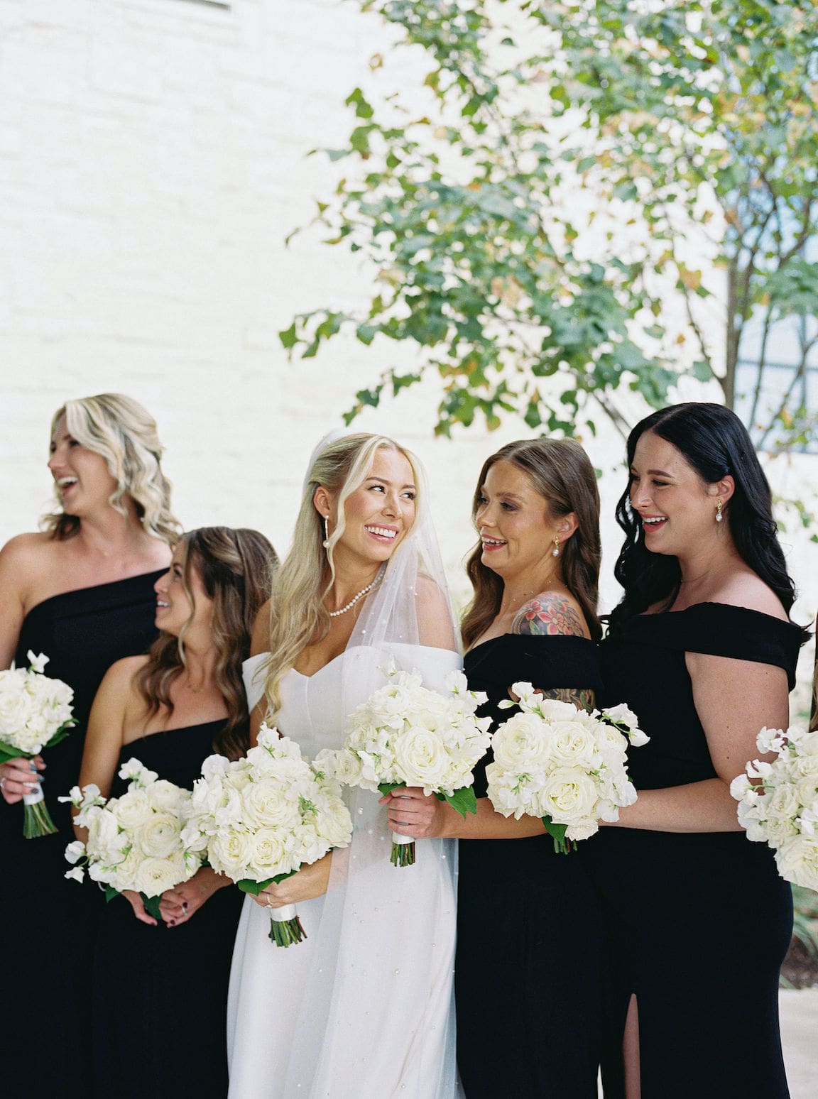 Bride getting ready in elegant suite at Omni Barton Creek, captured in timeless film wedding photography