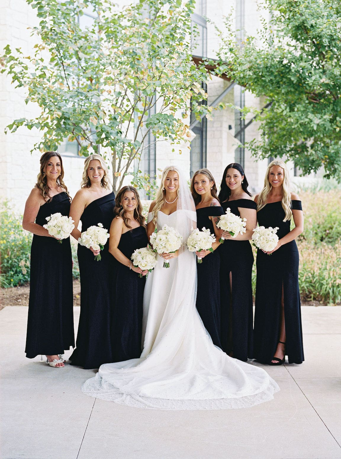 Bride getting ready in elegant suite at Omni Barton Creek, captured in timeless film wedding photography