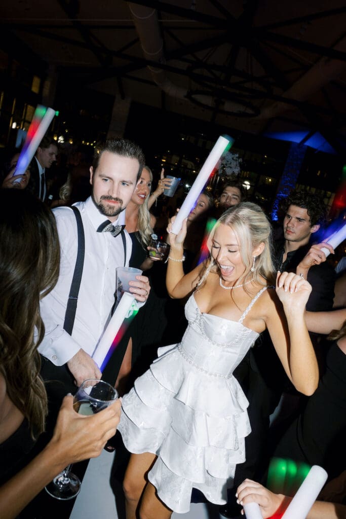 Packed dancefloor at Omni Barton Creek wedding with live band and joyful guests celebrating