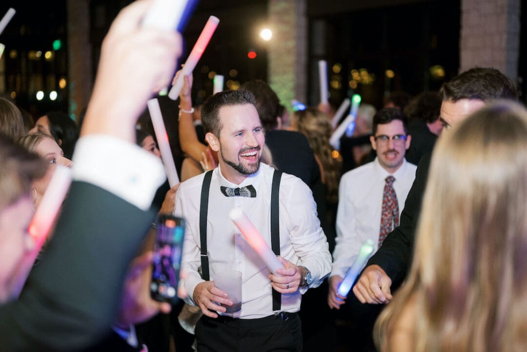 Packed dancefloor at Omni Barton Creek wedding with live band and joyful guests celebrating