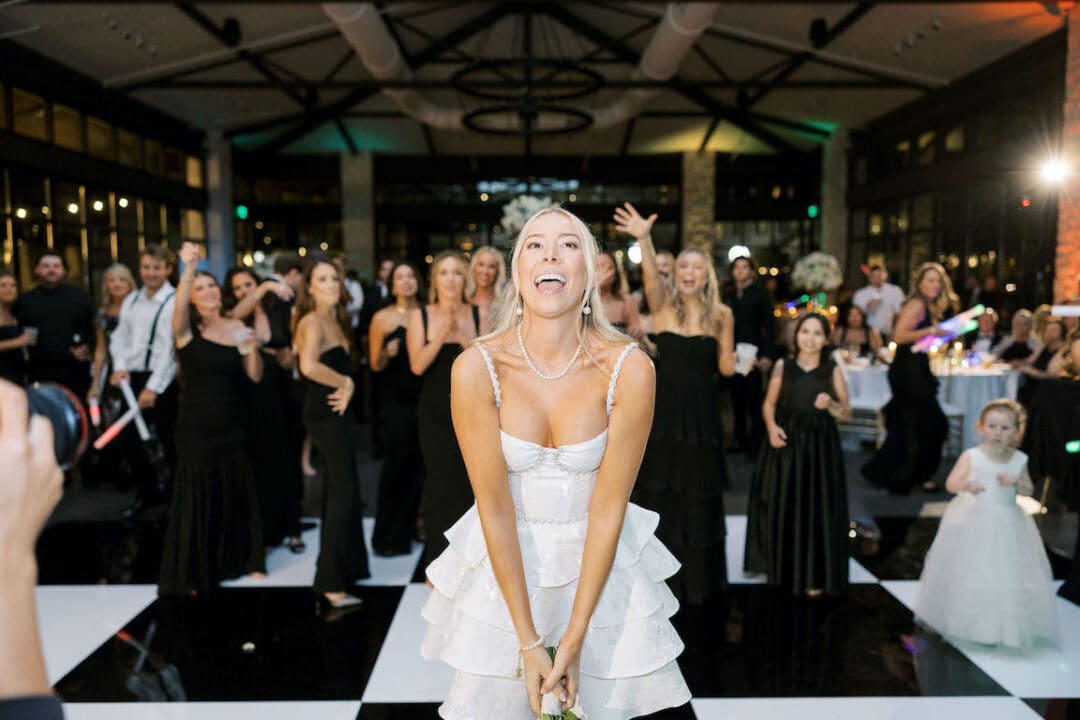Packed dancefloor at Omni Barton Creek wedding with live band and joyful guests celebrating