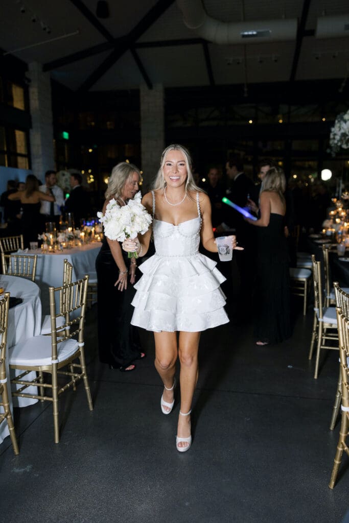 Packed dancefloor at Omni Barton Creek wedding with live band and joyful guests celebrating