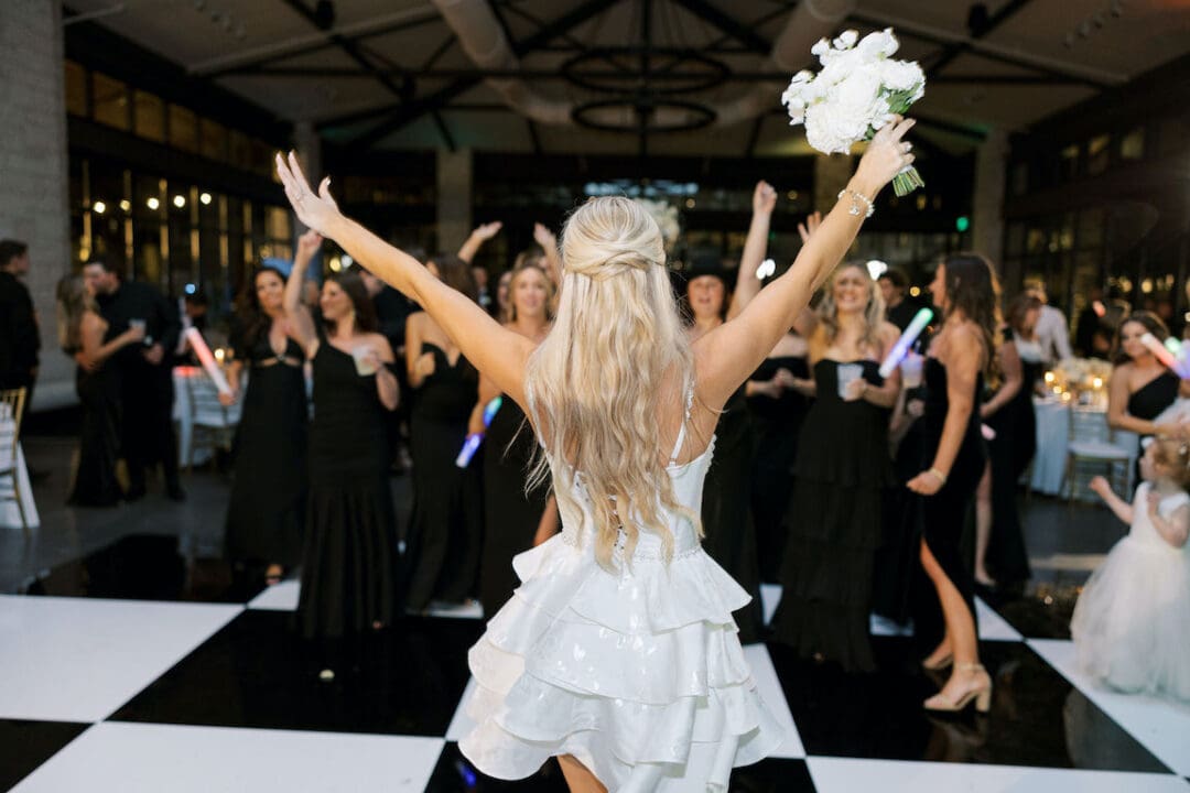 Packed dancefloor at Omni Barton Creek wedding with live band and joyful guests celebrating