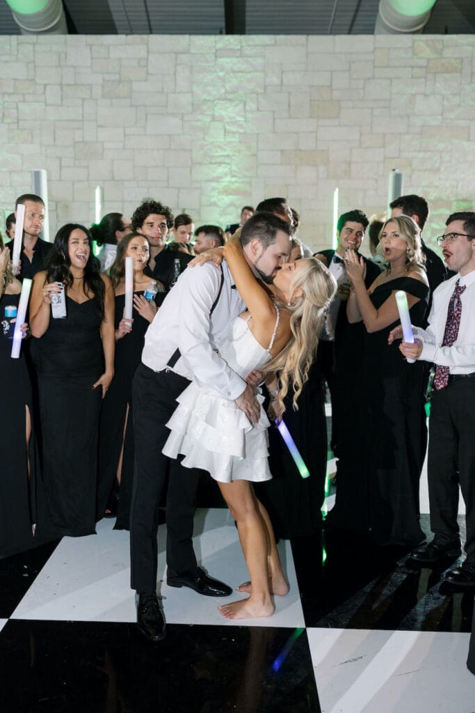 Packed dancefloor at Omni Barton Creek wedding with live band and joyful guests celebrating