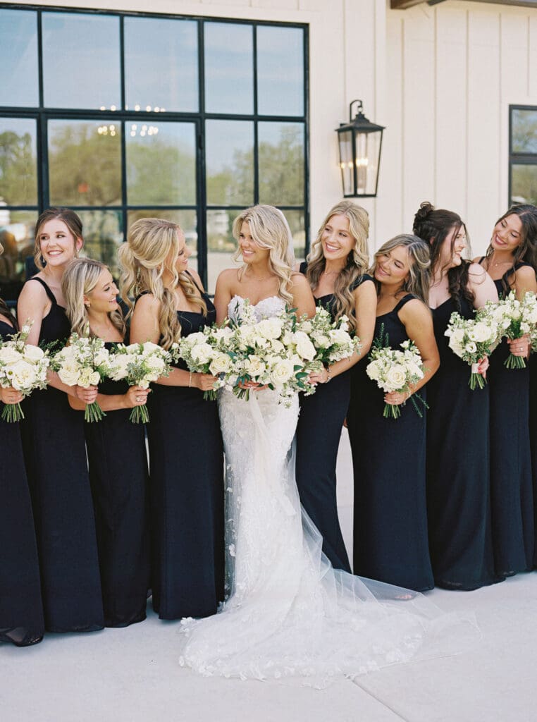 Candid laughter during wedding party photos at Dos Palomas Ranch