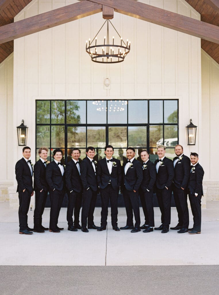 Candid laughter during wedding party photos at Dos Palomas Ranch