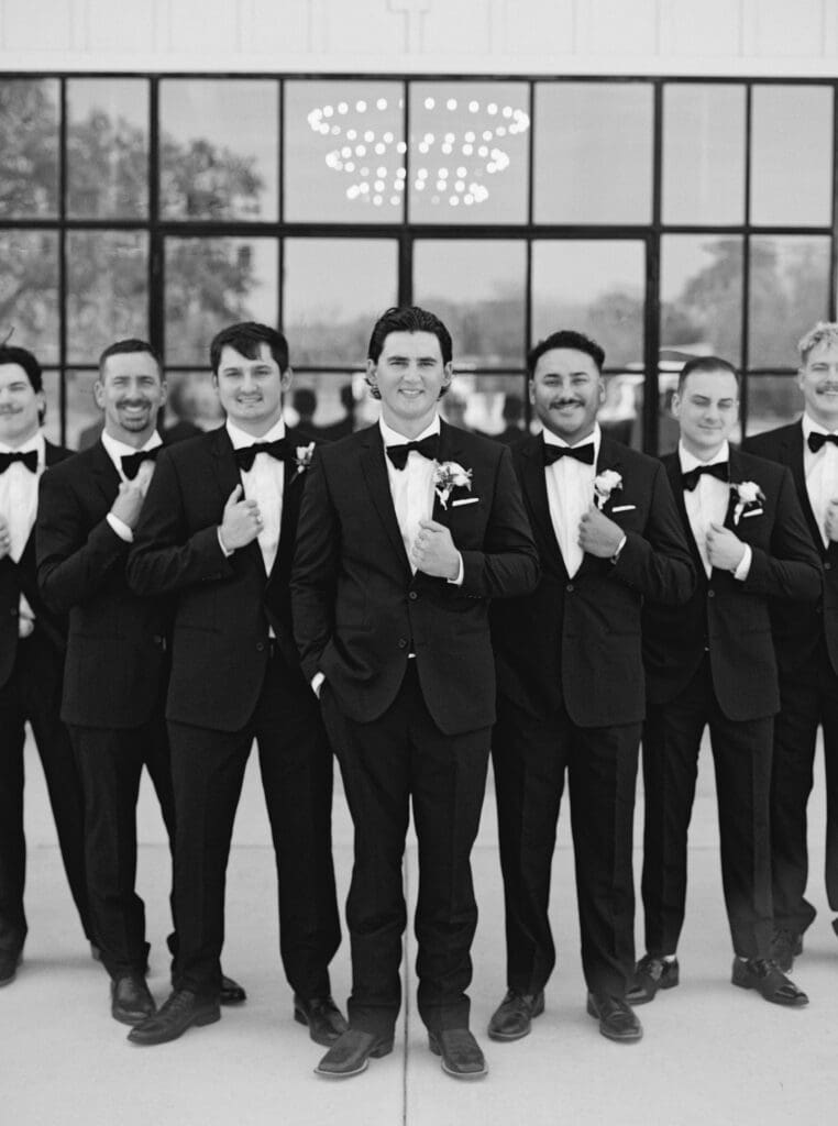 Candid laughter during wedding party photos at Dos Palomas Ranch