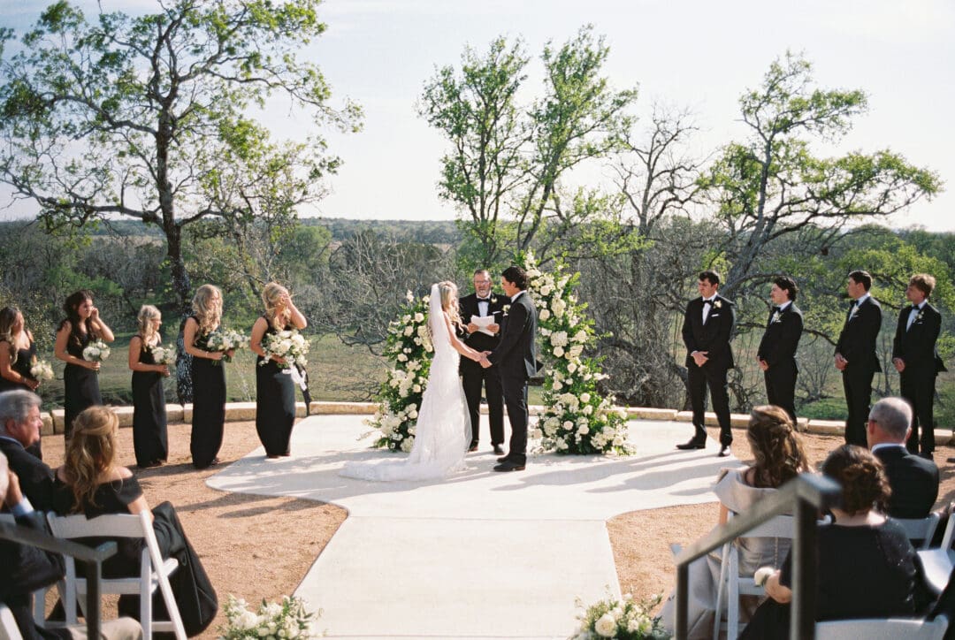 romantic ceremony with lush florals at Dos Palomas Ranch