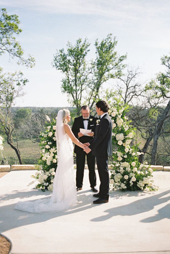 romantic ceremony with lush florals at Dos Palomas Ranch