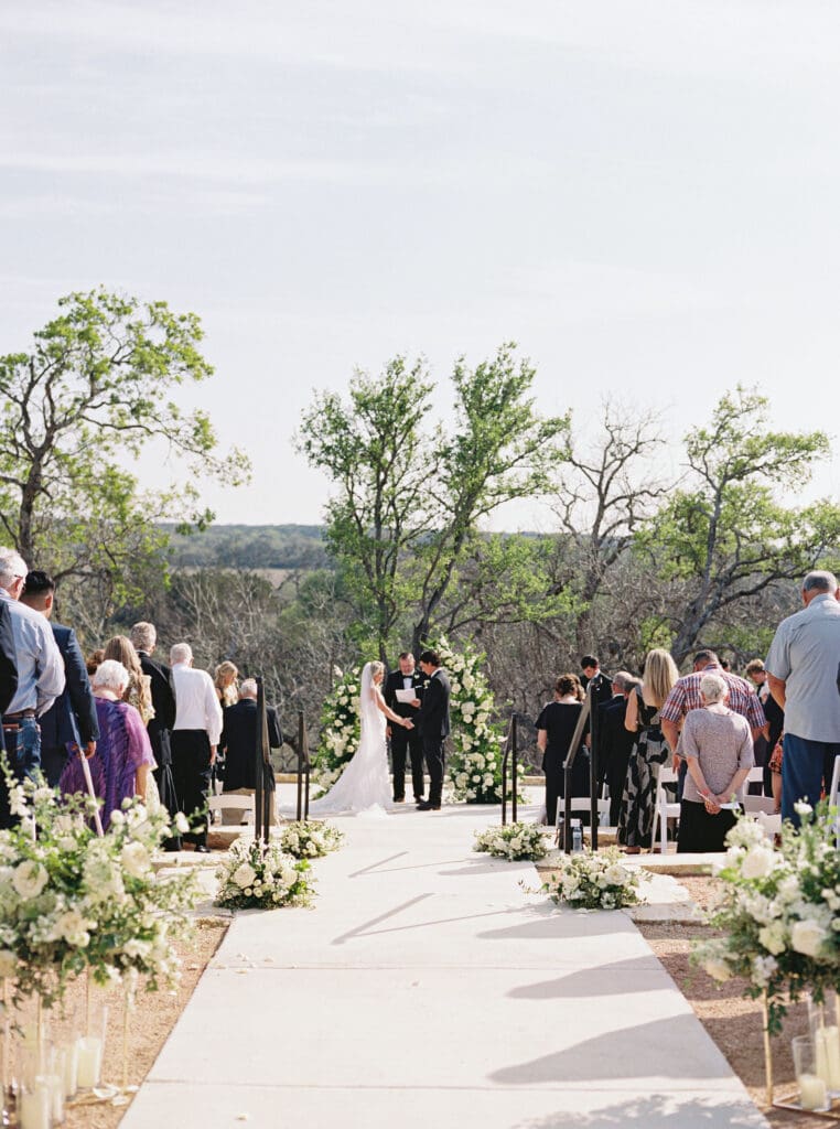 romantic ceremony with lush florals at Dos Palomas Ranch