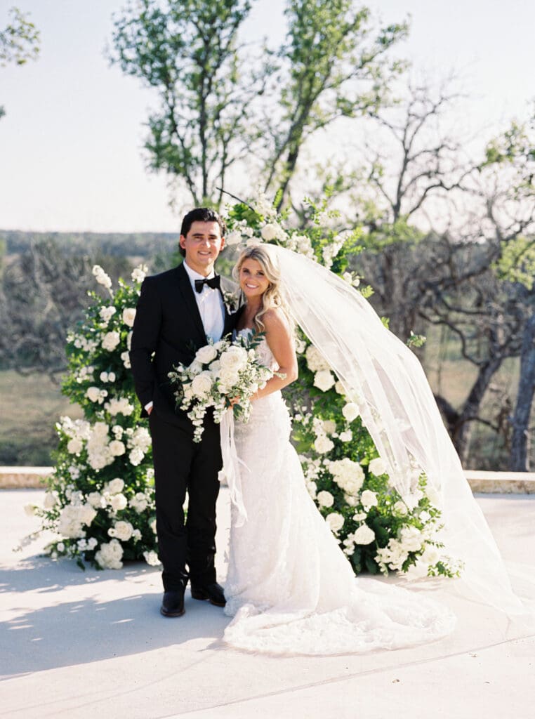 Bride and groom embracing at sunset at Dos Palomas Ranch wedding