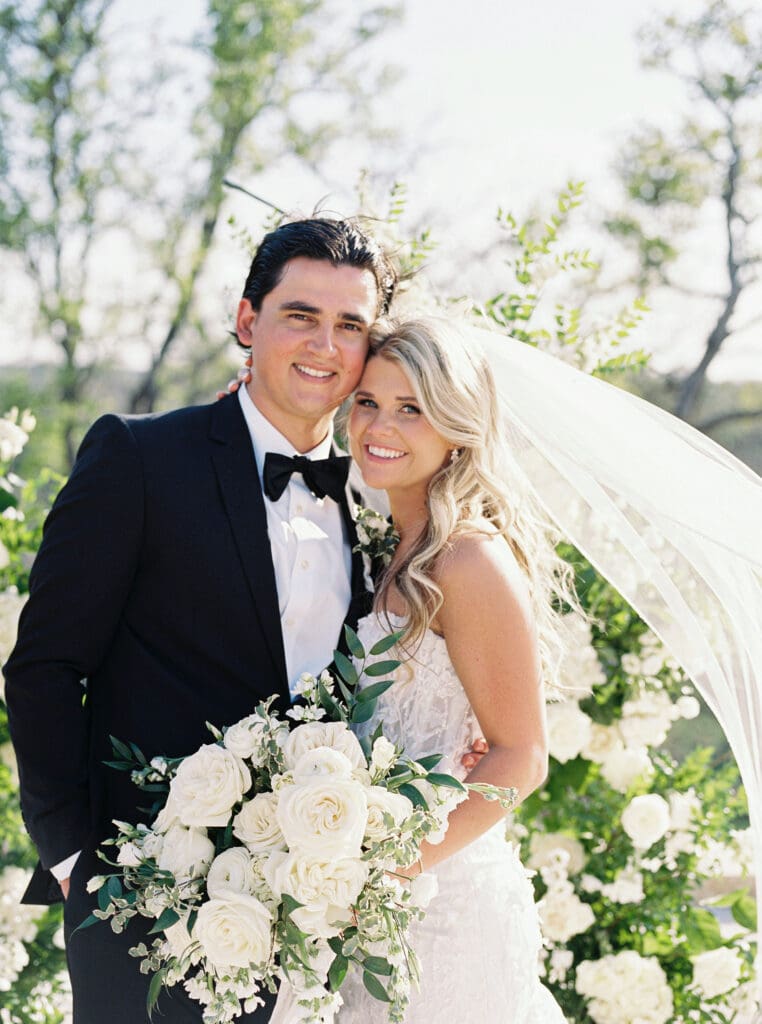 Candid laughter during bride and groom portraits at Dos Palomas Ranch