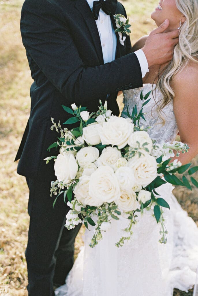 Bride and groom embracing at sunset at Dos Palomas Ranch wedding
