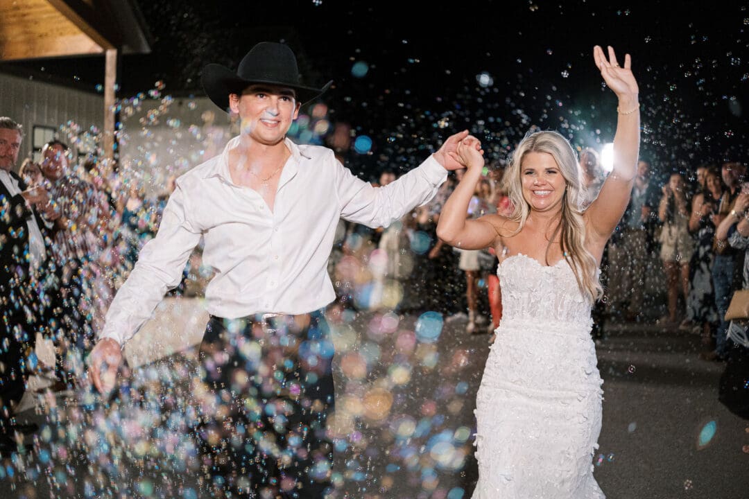 romantic bride and groom exit at Dos Palomas Ranch wedding photographed by Diana Brewer