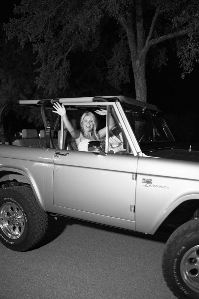Bronco exit car with bride and groom at Dos Palomas Ranch wedding photographed by Diana Brewer