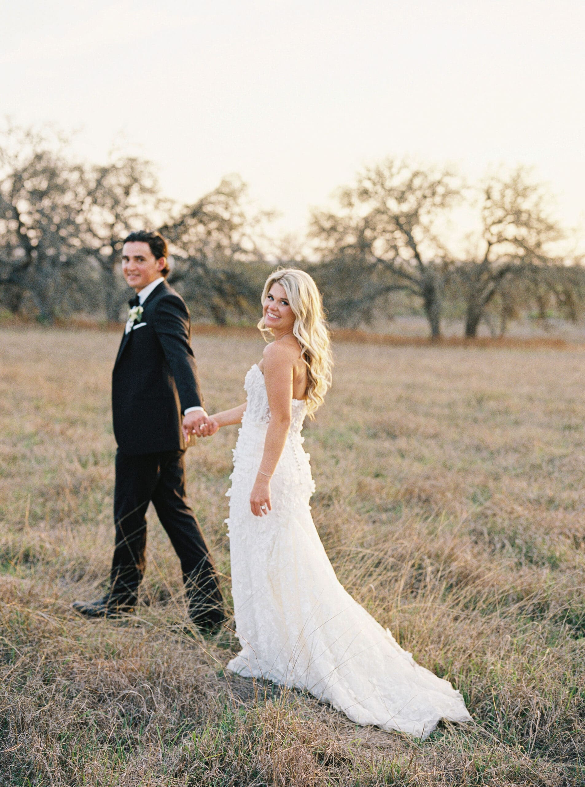 Bride and groom embracing at sunset at Dos Palomas Ranch wedding