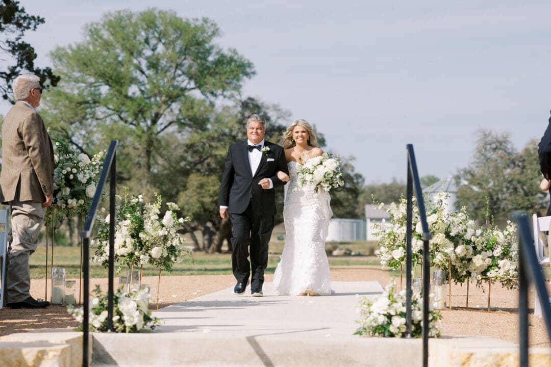 romantic ceremony with lush florals at Dos Palomas Ranch