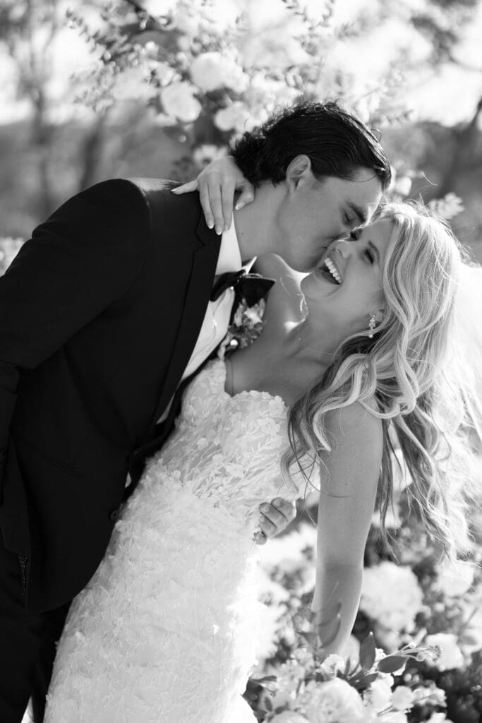 Candid laughter during bride and groom portraits at Dos Palomas Ranch