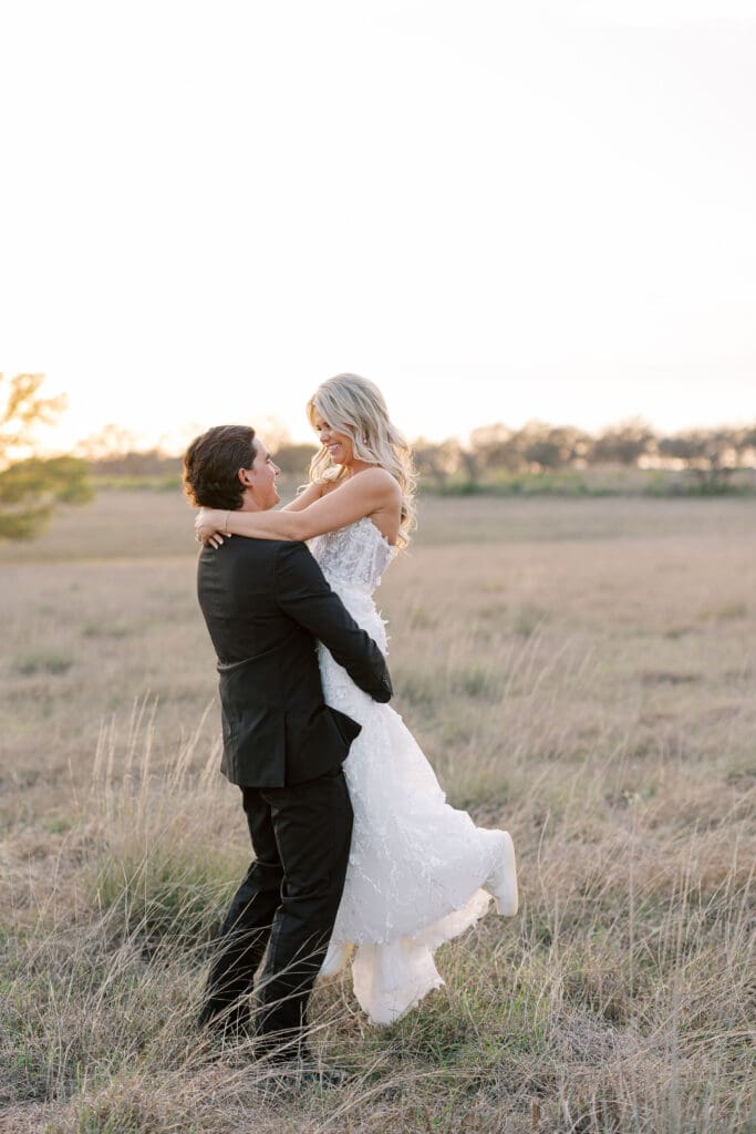 Bride and groom embracing at sunset at Dos Palomas Ranch wedding